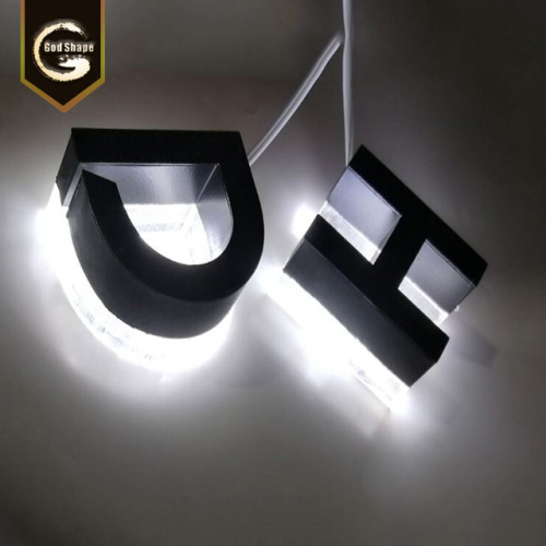 Espejo personalizado de acero inoxidable con halo iluminado con letras del alfabeto.