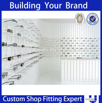 Simple style white wall mouted sunglasses optical store design