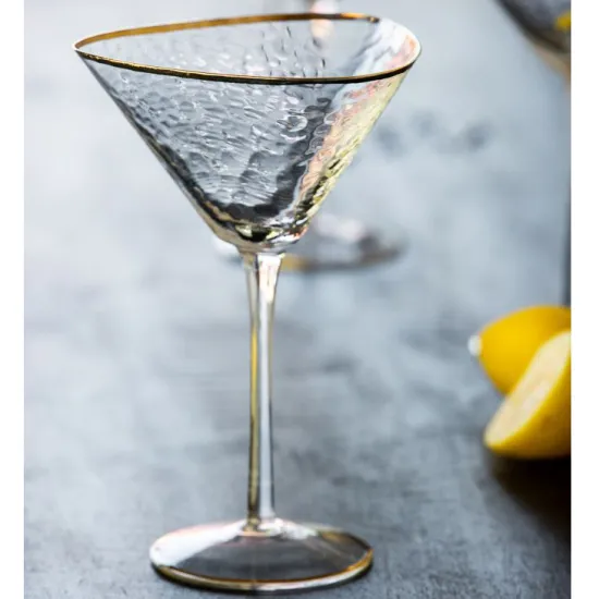 organic cocktail martini glass with gold rim
