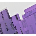 Hoja de papel de lija con bloque de lijado