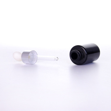 Black essential oil bottles with white rubber bulb