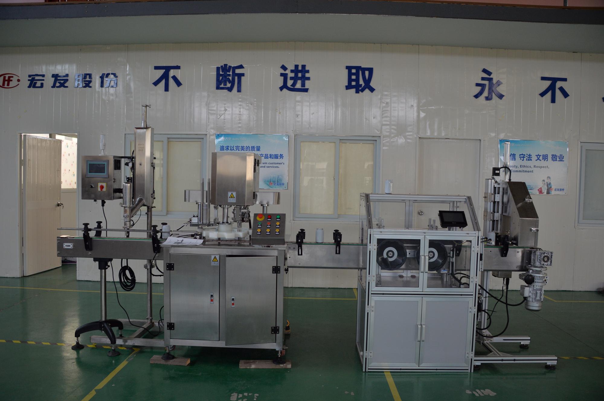 Filling and sealing machine for cans