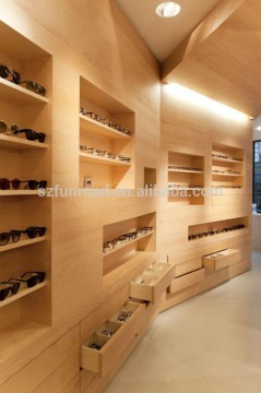 Customized eyewear retail store laminated wooden fixtures with wood grains illuminated sunglasses display cases