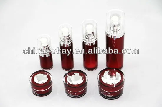 red face serum bottle and cosmetic cream jar