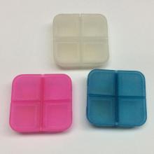 Mini caja de pastillas de plástico de cuatro rejillas portátil