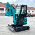 Backhoe mini penggali dengan trek getah