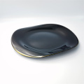 Elegante juego de platos de vaso negro irregular