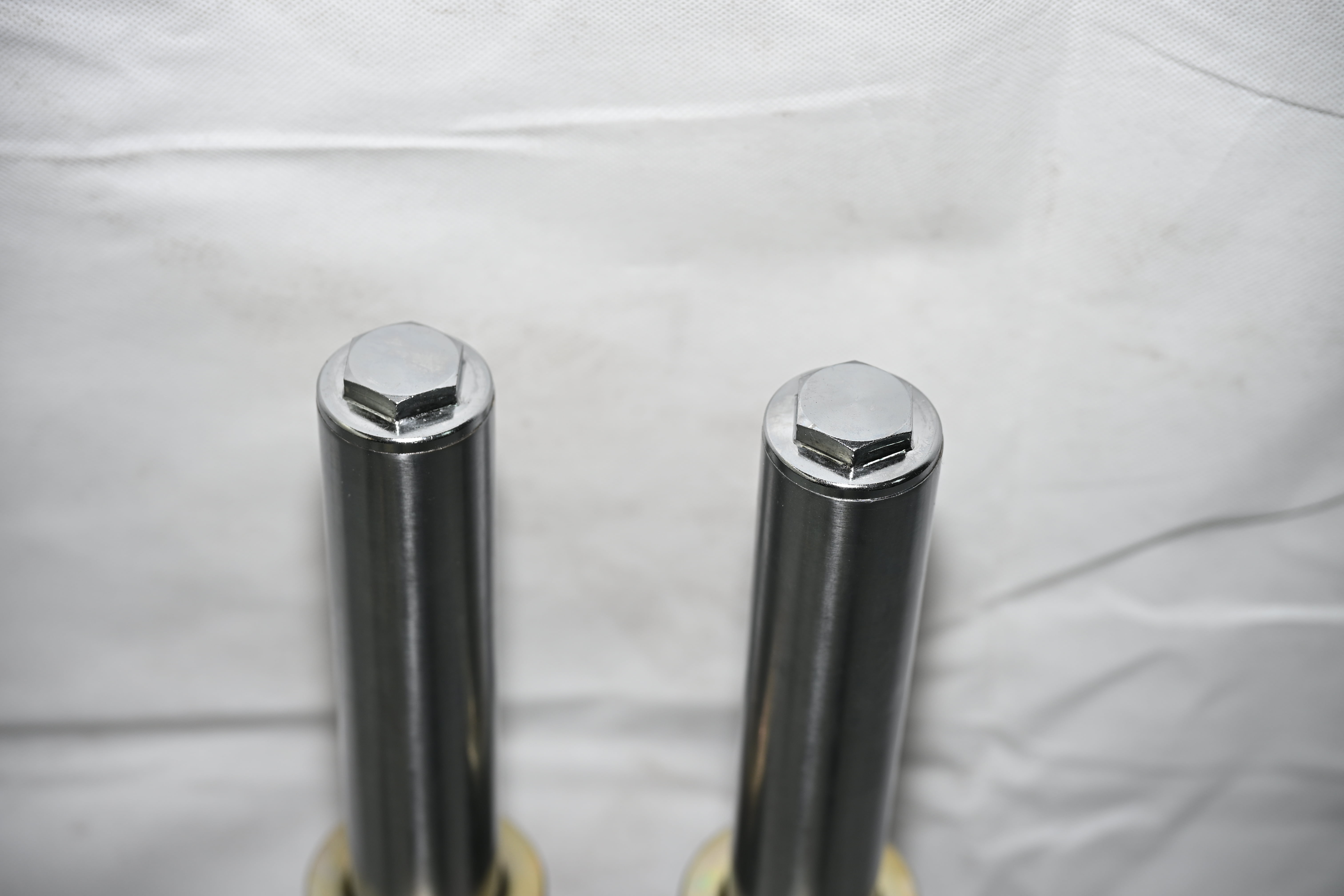 External spring tip shock absorber