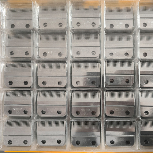 Máquina de escrita com carregamento automático para pentes-guia e lâminas de barbear