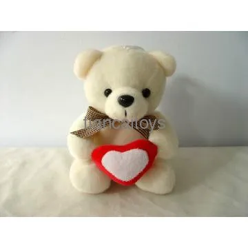 white teddy bear with heart
