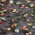Kolorowy tiul płaski haftowany materiał w małe kwiaty