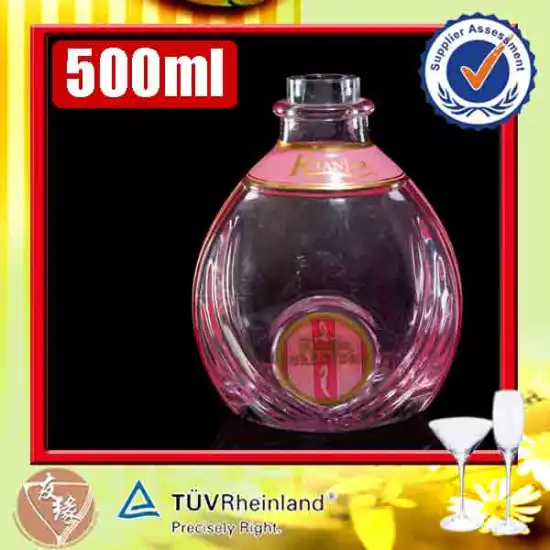 Bulk wholesale transparent pink color high flint glass 500ml round embossed antique liquor bottles