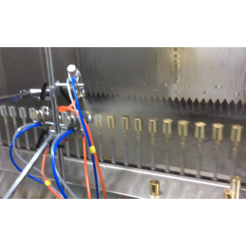 Industrial spray machine with UV curing dryer