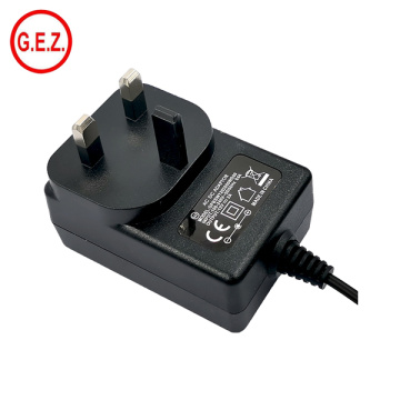 Adaptador CE UK Plug 12V 2A Fuente de alimentación