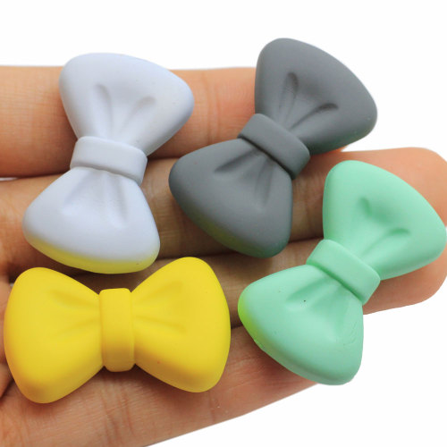 Bowknot in resina con foro da 4 mm Multi colori Accessorio fai da te Papillon artificiale Craft Kids Clothes Ornament