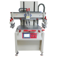 Flat screen printing machine with vacuum table