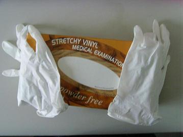 Disposable vinyl examination glove