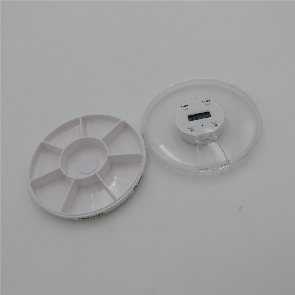 small round pill case with alarm