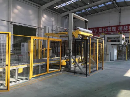 Integrated top sheet dispenser with pallet wrapper