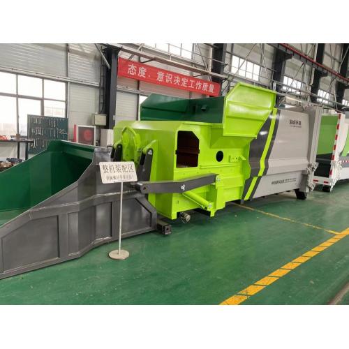 Vehicle mounted garbage compressor