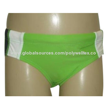 Boy's swim brief, in solid green, with contrasted panels and pipings at two sides, a print on left