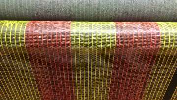Woven barrier mesh construction