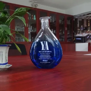 Empty transparent blue flat shape 750 ml tequila bottles with cork