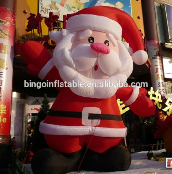 tall infltable Santa Shaped Inflatable Designed to hold a customized banner 18ft