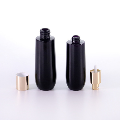 Black glass bottle with golden aluminum cap