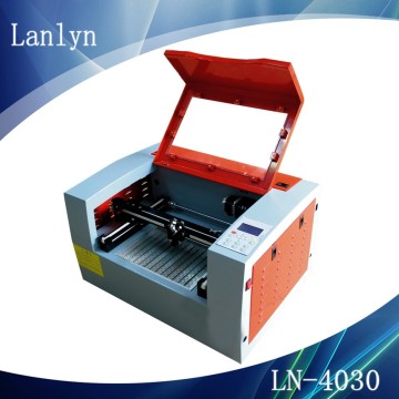 best sellers in china used for non mental co2 hot sale mini laser cutting machine on rubbere sheet/acrylic/plastic