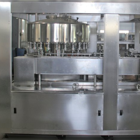 Filling and sealing machine for cans