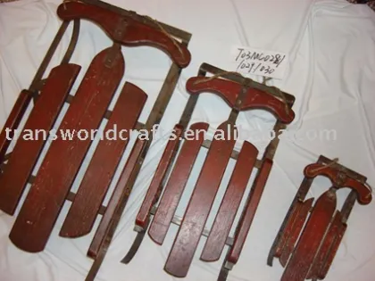 red painted wooden sled