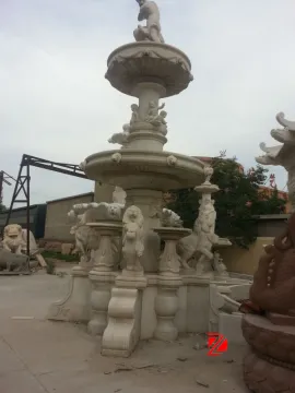 marble fountain with lion and statue