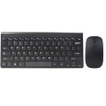 Ett svart trådlöst tangentbord och en mus för bärbar dator