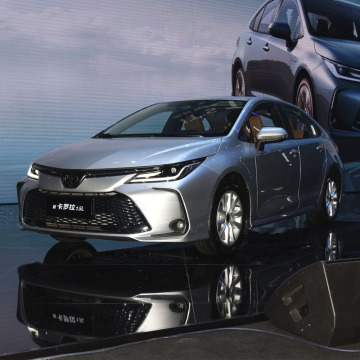 2023 Toyota Corolla Gas Petrol CVT Hybrid Car" 

Note: There seems to be a small error in your original phrase, as Toyota Corolla does not come with a dual engine setup. It can be available in hybrid variants, but typically has a single engine.