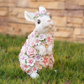 Dekorative solarbetriebene Ostergartenstatue: Ein leuchtendes Kaninchen mit Blütentraining
