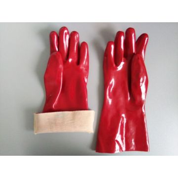 Guantes recubiertos de PVC azules impermeables.