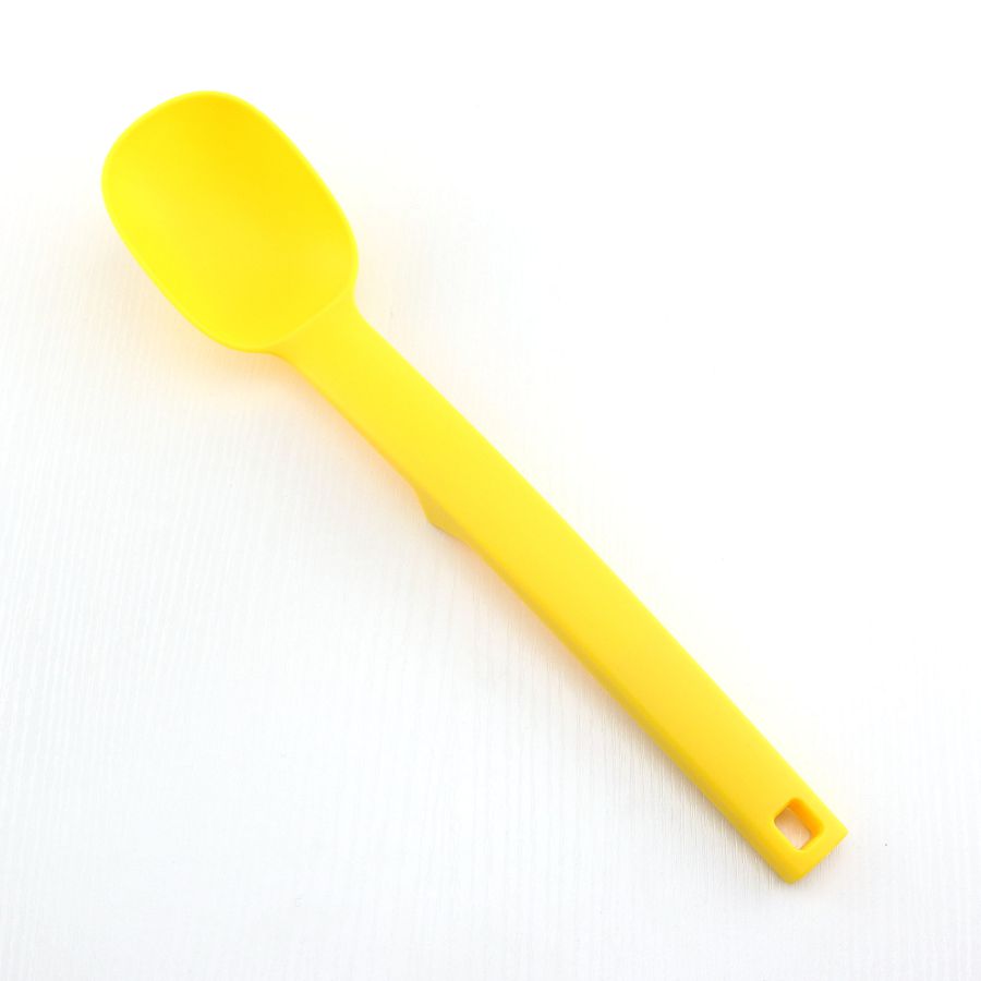 Cuchara maciza de nylon resistente al calor, de color amarillo, para cocina