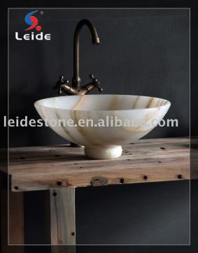 Onyx basin with wood bracket