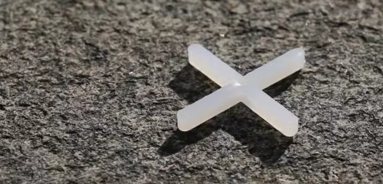 White ceramic tile with seam cross