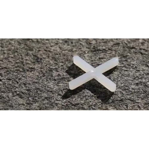White ceramic tile with seam cross