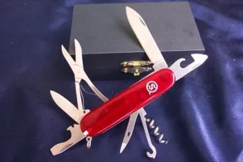 multi-purpose knife w,red plastic inlay handle