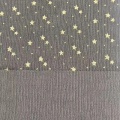 Kettkreppstoff mit Goldstern-Foliendruck