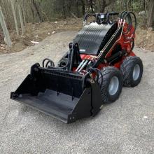 New track stand on skid steer loader