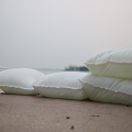 Free standing self inflating flood prevention sandbags