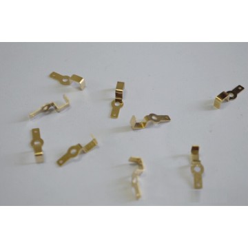 Metal stamping with gold-plated bent shrapnel