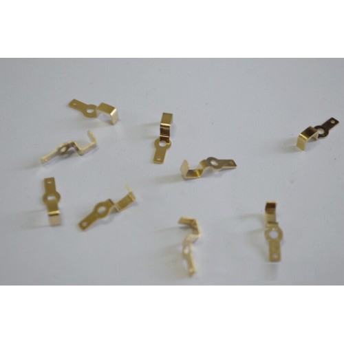 Metal stamping with gold-plated bent shrapnel