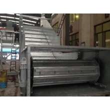 Slat conveyor dengan lereng