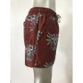 Reddish brown retro totem men's beach shorts