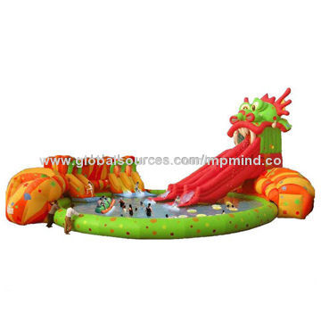 Amusement park water slide with huge inflatable fantasy dragon pool